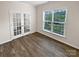 An office space with double glass doors and a bright window with neighborhood views at 3486 Duchess Ave, Fort Mill, SC 29707
