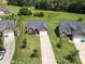 An aerial shot displays a home's location within a community with mature trees and well-maintained lawns at 3523 Brickwood Cir, Midland, NC 28107