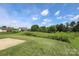 View of a patio and expansive backyard and trees at 3523 Brickwood Cir, Midland, NC 28107