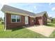 Patio and backyard with a brick elevation at 3523 Brickwood Cir, Midland, NC 28107