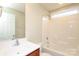 Neutral bathroom featuring a shower and vanity with window providing natural light at 3523 Brickwood Cir, Midland, NC 28107