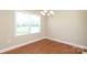 Bright dining room featuring hardwood floors, natural light, and neutral paint at 3523 Brickwood Cir, Midland, NC 28107