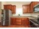 The kitchen features stainless steel appliances, granite countertops, and wood cabinets at 3523 Brickwood Cir, Midland, NC 28107