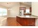 Beautiful kitchen with a stainless steel refrigerator and a sink island with granite countertops at 3523 Brickwood Cir, Midland, NC 28107