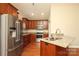 The kitchen features stainless steel appliances, granite countertops, and wood cabinets at 3523 Brickwood Cir, Midland, NC 28107