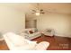 Spacious living room featuring hardwood floors, ceiling fan, neutral walls, and comfortable seating at 3523 Brickwood Cir, Midland, NC 28107
