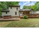 Exterior view of home with deck, hot tub, patio, and lush backyard at 3884 Snider Cir, Hickory, NC 28602