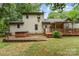 Exterior view of home with deck, hot tub, patio, and landscaped yard at 3884 Snider Cir, Hickory, NC 28602