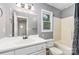 Gray-painted bathroom with vanity sink, mirror, toilet, and shower-tub combo at 3884 Snider Cir, Hickory, NC 28602