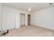 This bedroom features a ceiling fan, closet, and neutral carpeting at 3884 Snider Cir, Hickory, NC 28602