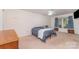 Cozy bedroom with large windows, a ceiling fan, and neutral carpeting at 3884 Snider Cir, Hickory, NC 28602