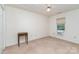 Bright bedroom with ceiling fan, window AC, carpet, and small side table at 3884 Snider Cir, Hickory, NC 28602