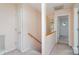 Hallway with a wooden staircase and a door to another room at 3884 Snider Cir, Hickory, NC 28602