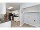 Bright kitchen features white cabinets, stainless steel appliances, and durable gray floors at 3884 Snider Cir, Hickory, NC 28602