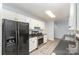 The kitchen features stainless steel appliances, granite counters, and white cabinets at 3884 Snider Cir, Hickory, NC 28602