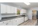 The kitchen features white cabinets, granite counters, and stainless steel appliances at 3884 Snider Cir, Hickory, NC 28602