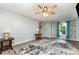 Cozy living room features a ceiling fan, neutral walls, wood-look floors, and an arched doorway at 3884 Snider Cir, Hickory, NC 28602