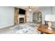 Inviting living room features a stone fireplace, ceiling fan, and a seamless flow into the dining area at 3884 Snider Cir, Hickory, NC 28602