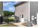 Backyard patio with an air conditioning unit, gray siding, and a view of the neighborhood at 3965 Hemingway Dr, Hickory, NC 28601