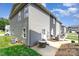 Backyard patio with an air conditioning unit, gray siding, and a view of the neighborhood at 3965 Hemingway Dr, Hickory, NC 28601
