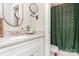 Bathroom featuring granite countertop vanity and decorative mirrors with a shower at 3965 Hemingway Dr, Hickory, NC 28601