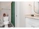 Cozy bathroom features a granite vanity and a shower with a decorative green curtain at 3965 Hemingway Dr, Hickory, NC 28601