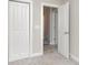 Neutral-colored hallway with white trim, bi-fold closet, and access to other rooms at 3965 Hemingway Dr, Hickory, NC 28601