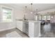 Open kitchen with breakfast bar, stainless steel appliances, and easy access to the living room at 3965 Hemingway Dr, Hickory, NC 28601