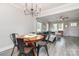 Bright open-concept living room with dining area, wood floors, and comfortable seating arrangement at 3965 Hemingway Dr, Hickory, NC 28601