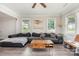 Comfortable living room with a large sectional sofa, wood-look floors, and a rustic coffee table at 3965 Hemingway Dr, Hickory, NC 28601