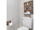 Toilet with a decorative shelf, jars, and a toilet paper holder at 3965 Hemingway Dr, Hickory, NC 28601