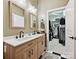 Bathroom features a double vanity, natural light, and a walk in closet at 404 N Laurel Ave # 11, Charlotte, NC 28204