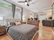 Bright bedroom with hardwood floors, large window, and view into living room at 404 N Laurel Ave # 11, Charlotte, NC 28204