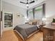 Bedroom with hardwood floors, large window, and a spacious walk-in closet at 404 N Laurel Ave # 11, Charlotte, NC 28204