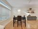 Bright dining area featuring hardwood floors, large window, and stylish decor at 404 N Laurel Ave # 11, Charlotte, NC 28204