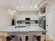 Kitchen island features granite countertops and stainless steel appliances at 404 N Laurel Ave # 11, Charlotte, NC 28204