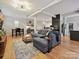 Open concept living space with hardwood floors and comfortable seating at 404 N Laurel Ave # 11, Charlotte, NC 28204