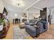Spacious living room with hardwood floors, modern lighting and comfortable seating at 404 N Laurel Ave # 11, Charlotte, NC 28204