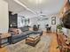 Open-concept living room with comfortable seating, hardwood floors, and modern décor at 404 N Laurel Ave # 11, Charlotte, NC 28204