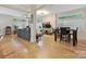 Spacious living room features hardwood floors, large windows, and an adjacent dining area at 404 N Laurel Ave # 11, Charlotte, NC 28204