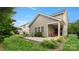 Spacious backyard with manicured lawn, patio and lush landscaping on a sunny day at 424 Paperbark Ln, Rock Hill, SC 29732