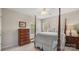 Bedroom with neutral walls and furniture with a four-poster bed and bright windows at 424 Paperbark Ln, Rock Hill, SC 29732