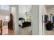 View from hallway to bedroom showing a queen bed and into the primary closet at 424 Paperbark Ln, Rock Hill, SC 29732