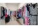 Walk-in closet filled with colorful clothing hung on wire shelving at 424 Paperbark Ln, Rock Hill, SC 29732