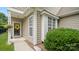 Close up of front entrance shows landscaping, and black front door with wreath at 424 Paperbark Ln, Rock Hill, SC 29732