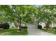 View of the home's exterior featuring an attached garage, driveway, and landscaped yard at 424 Paperbark Ln, Rock Hill, SC 29732