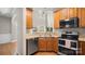 Bright kitchen with stainless appliances, wooden cabinets, and plenty of counter space at 424 Paperbark Ln, Rock Hill, SC 29732
