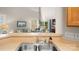 Bright open-concept kitchen with view into living room and backyard at 424 Paperbark Ln, Rock Hill, SC 29732