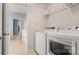 Convenient laundry room with modern washer and dryer, leading to bath at 424 Paperbark Ln, Rock Hill, SC 29732