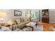 Comfortable living area with a sofa, armchairs, and a view of the backyard at 424 Paperbark Ln, Rock Hill, SC 29732
